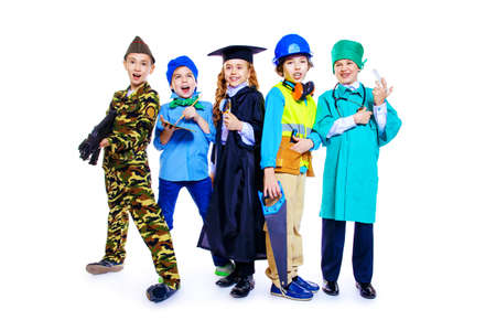 Different professions. A group of children dressed in costumes of different professions. Isolated over white.の写真素材