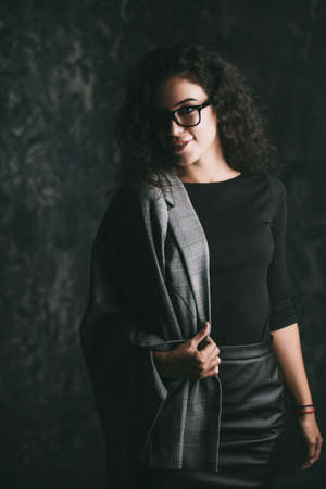 Portrait of a beautiful  businesswoman wearing glasses. Studio shot.の写真素材