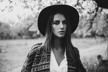 Fashion shot. Stylish young woman in boho clothes in a city. Ethnics, boho style.の写真素材