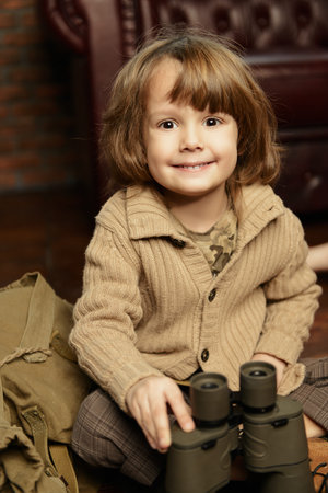 Smiling boy playing at home in traveler. Childhood. Fantasy, imagination. 