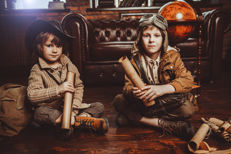 Two boys are playing at home to travelers. Childhood. Fantasy, imagination. の写真素材