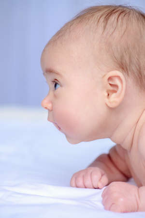 Close-up portrait of a sweet three-month-old baby. Baby care. Healthcare.の写真素材