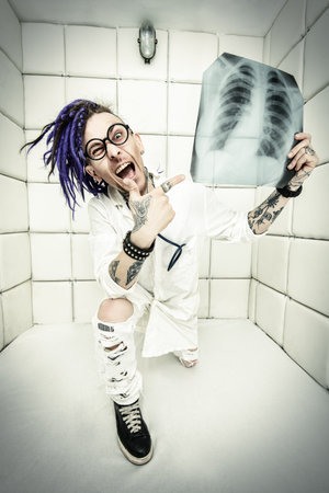 Portrait of a cheerful crazy doctor in a psychiatric hospital.