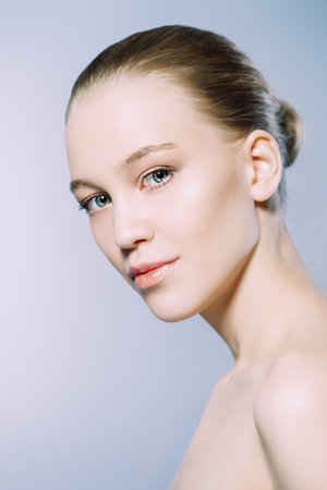Close-up portrait of a beautiful girl with healthy shiny skin. Beauty, fashion. Skincare,...