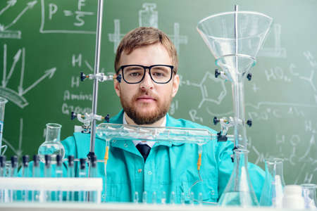 Smart man scientist making chemical experiments in the laboratory. Educational concept. Discovery. の写真素材