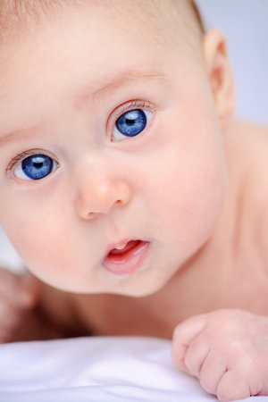 Close-up portrait of a sweet three-month-old baby. Baby care. Healthcare.の写真素材