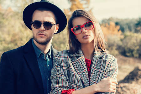 Close-up portrait of a beautiful young people walking in the autumn park. Autumn fashion. の写真素材