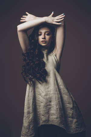 Beautiful red-haired teen girl wearing in light casual clothes. Beauty, fashion concept. Summer style.の写真素材