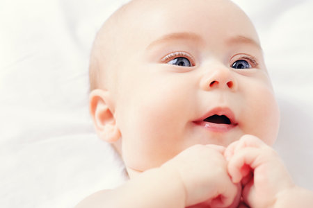 Close-up portrait of a sweet three-month-old baby. Baby care, Healthcare.