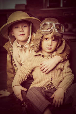 Two boys are playing at home to travelers. Childhood. Fantasy, imagination.の写真素材