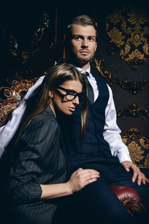 Beautiful gorgeous couple in elegant evening dresses. Luxurious interior. Fashion shot.の写真素材