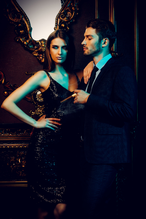 Sexual passionate couple in elegant evening dresses. Luxurious interior. Fashion shot.の写真素材