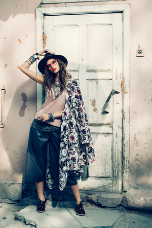 Beautiful sexy fashion woman posing outdoor. Fashionable clothes.の写真素材