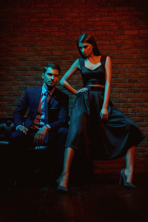 Sexual passionate couple in elegant evening dresses. Luxurious interior. Fashion shot.の写真素材