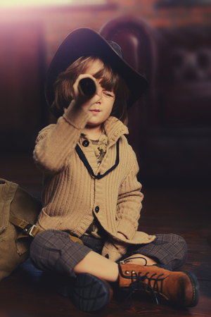 Child boy playing at home in traveler. Childhood. Fantasy, imagination.の写真素材