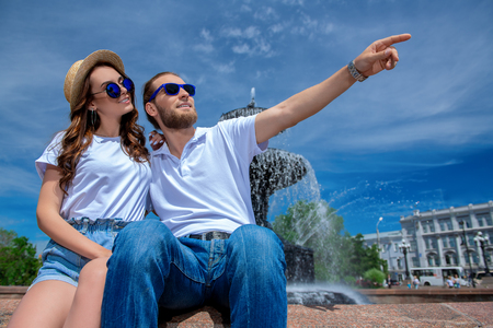 Happy young people in love in the park on a sunny summer day. Summer holidays. Love concept.の写真素材