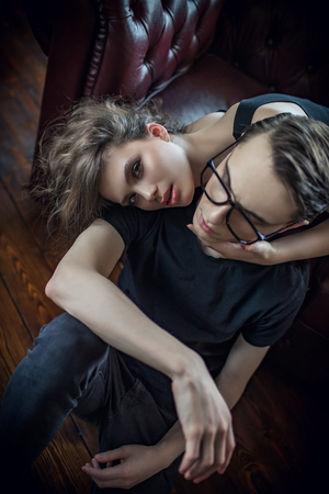 Portrait of an attractive young people in love at home. Beauty, fashion.の写真素材