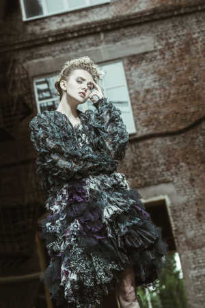 A nice lady posing outside. Cool style. Thoughtful ladyの写真素材