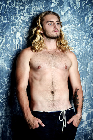 Portrait of a strong healthy handsome athletic man. Male beauty concept. Fitness, bodybuilding. の写真素材