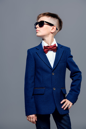 Children's fashion. Portrait of a boy in an elegant jacket and a bow tie.の写真素材