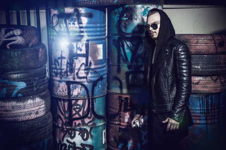 Portrait of a punk man in the street. Guy in the backyard. Fashion, subculture.の写真素材