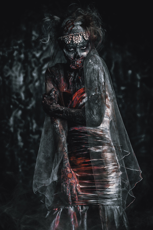 Portrait of a bloody dead bride woman. Zombie bride. Halloween. Horror.の写真素材
