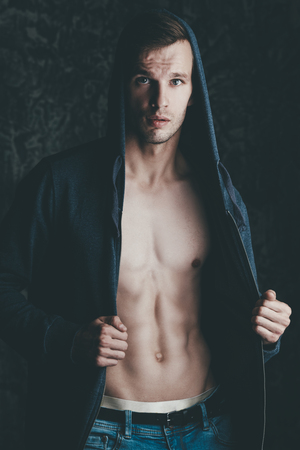 A beautiful man in a studio. Casual style. Fashion concept.の写真素材