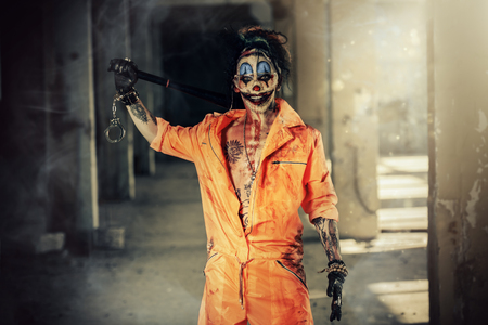 Crazy evil clown man stained in blood. Halloween. Horror, thriller film.の写真素材