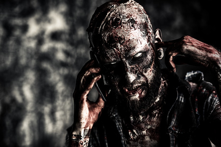 Close up of a creepy scary zombie. Halloween. Horror film.の写真素材