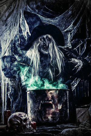 A witch is preparing spell. Halloween costume. Horror movie.の写真素材