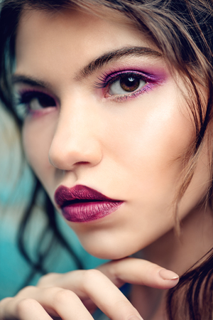 Close-up portrait of a attractive girl posing in studio. Beauty, fashion. Make-up and cosmetics concept.の写真素材