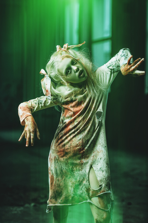 A portrait of a scary blonde girl. Halloween. Horror film.の写真素材