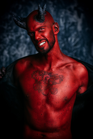 A portrait of a bad demon over the grunge background. Horror movie, nightmare. Halloween.の写真素材