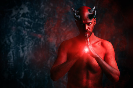 A portrait of a bad demon over the grunge background. Horror movie, nightmare. Halloween.