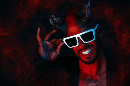 A portrait of a bad demon in sunglasses. Horror movie, nightmare. Halloween.