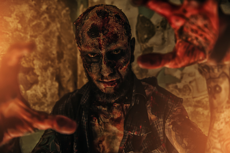 A portrait of a creepy scary zombie. Halloween. Horror film.の写真素材