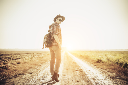 A traveller in the field. Nature, freedom. Fashion for active men.の写真素材