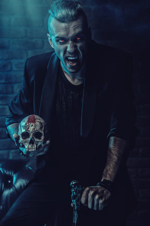 A portrait of a vampire man. Classic style. Beauty, fashion.
