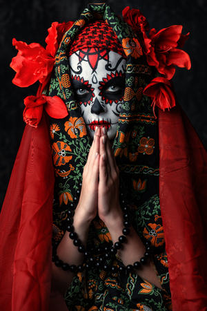 A close-up portrait of Calavera Catrina. Sugar skull makeup. Dia de los muertos. Day of The Dead. Halloween.の写真素材