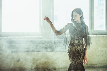 A portrait of a beautiful brunette lady. Evening dress. Fashion, beauty.の写真素材