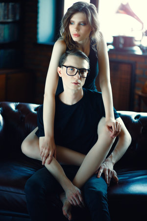 Portrait of attractive young people in love at home. Beauty, fashion.の写真素材