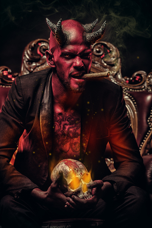 A portrait of a bad demon in his throne. Horror movie, nightmare. Halloween.の写真素材