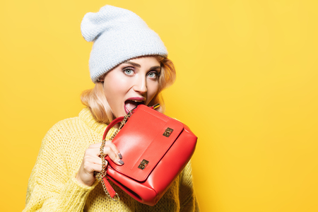 A portrait of a fashionable bright lady posing in studio.の写真素材