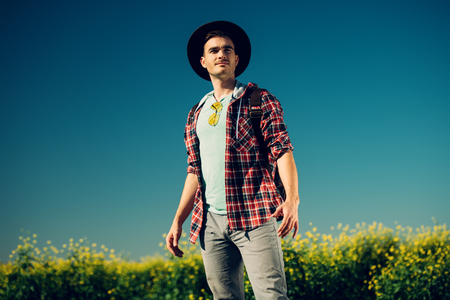 A portrait of a traveller in the field. Nature, freedom. Fashion for active men.の写真素材