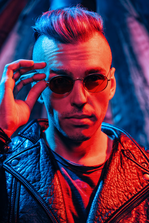 Portrait of a crazy disco man. Party, disco. Colorful light.の写真素材