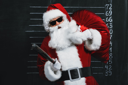 A portrait of criminal Santa Claus in sunglasses. Merry Christmas and Happy New Year!の写真素材