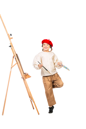 A full length portrait of a girl painting a picture. Creativity, artist.の写真素材