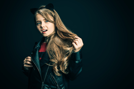 A portrait of a bright cute schoolgirl. Fashion for active kids.の写真素材