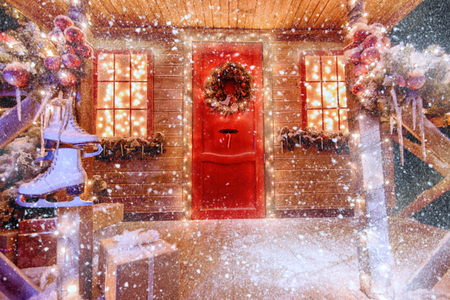 A porch decorated with luminous garlands for Christmas at home. Decorations for Christmas and New year. Magic miracle time.の写真素材
