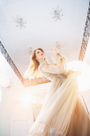 A portrait of a beautiful elegant woman in the fluttering wedding dress. Fashion, wedding dress.の写真素材